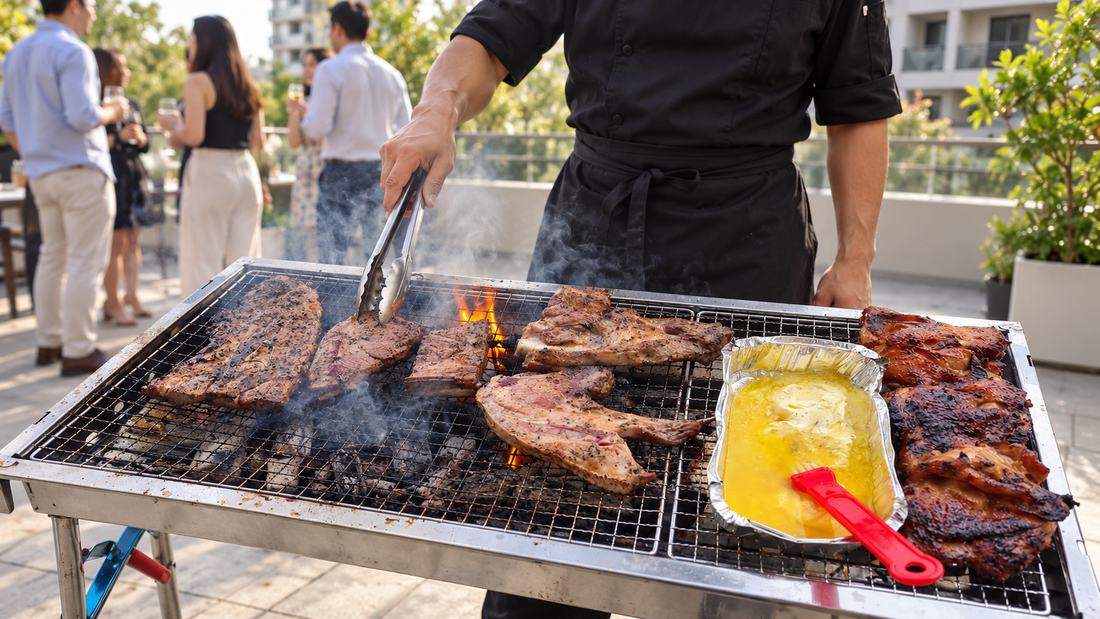 Chef grilling food beside a serving table at an outdoor BBQ event