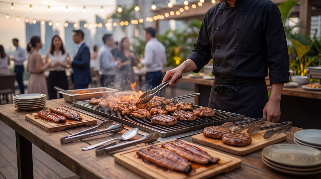 A professional chef grilling meats at a BBQ live station setup during a rooftop corporate event in Singapore — The Smokehouse Collective