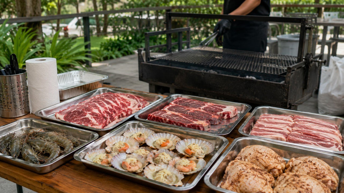 Raw BBQ meats and seafood arranged beside an outdoor grill for a BBQ food package in Singapore