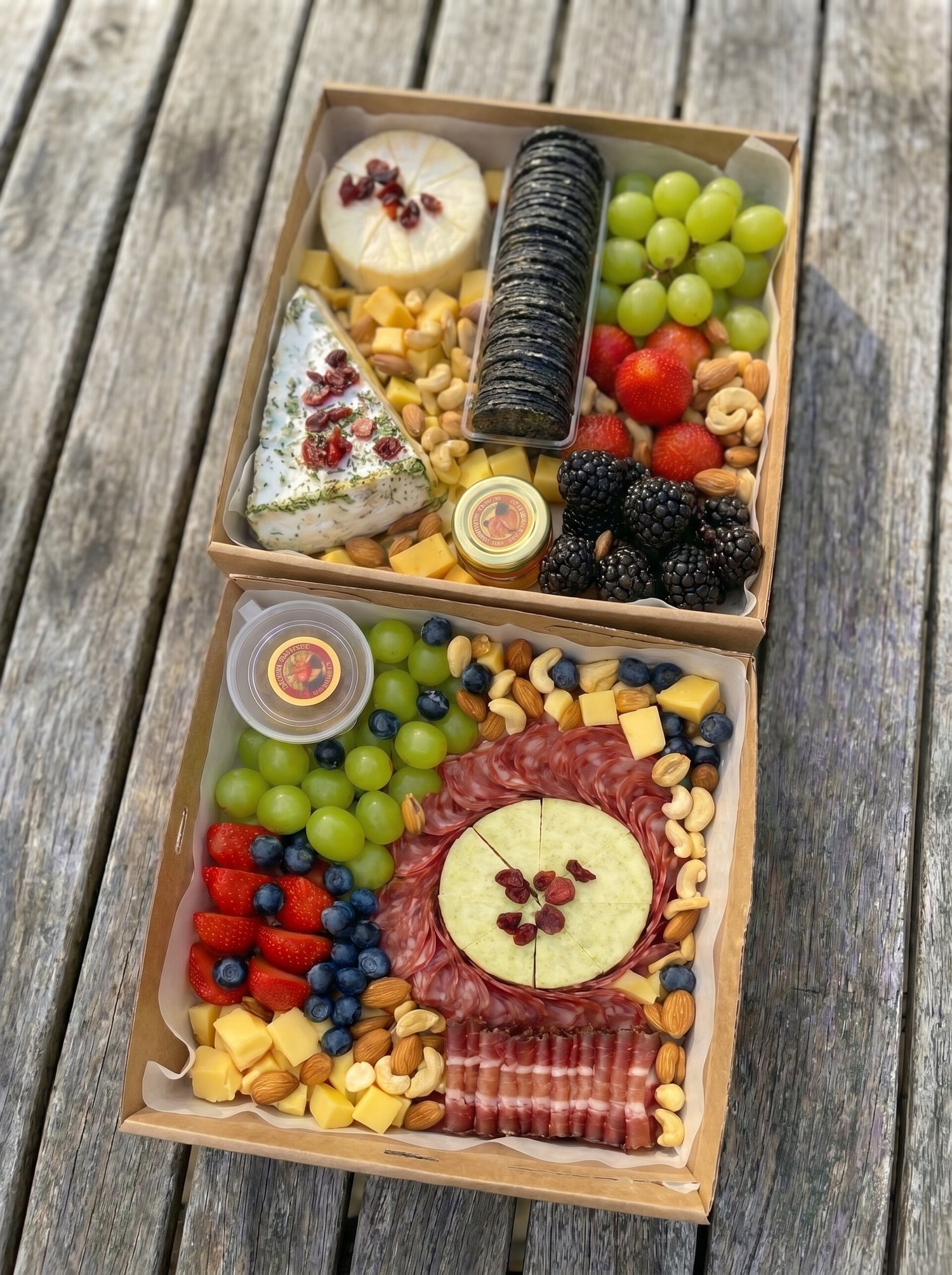 Cheese platter and meat charcuterie board boxes with cold cuts, fruits and crackers — sharing platters by The Smokehouse Collective Singapore